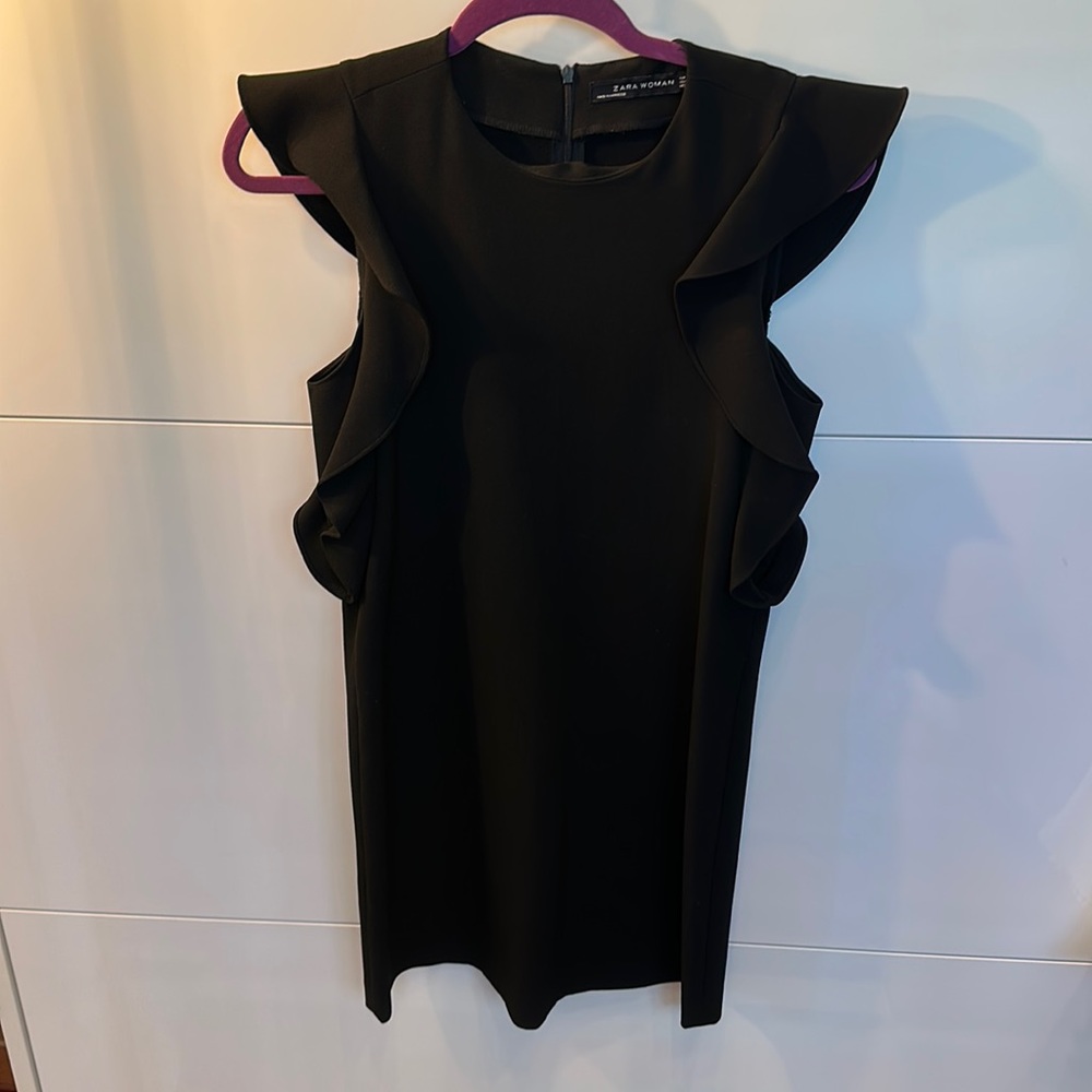 Black mini dress with ruffled shoulders